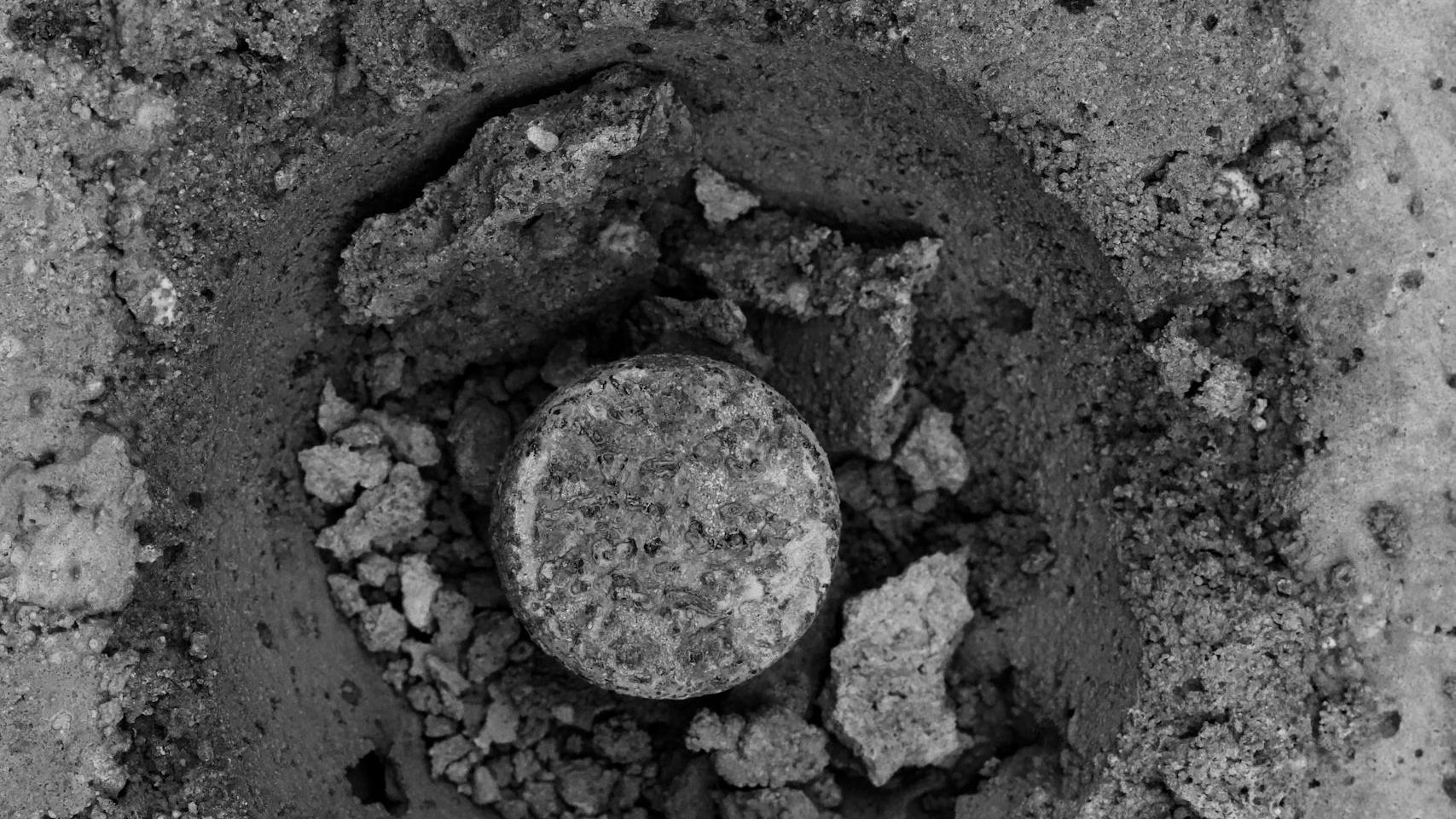 Abstract black and white photo capturing concrete textures and shapes.